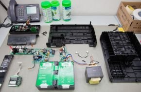 Technician repairing internal components of APC Smart UPS